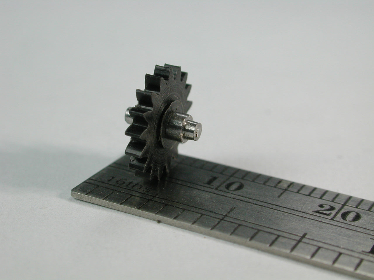 Spur Gear, 0.5mod x 17 Teeth x 9.3mm OD x 2.4mm Bore, Delrin, on 2.4mm Shouldered Shaft