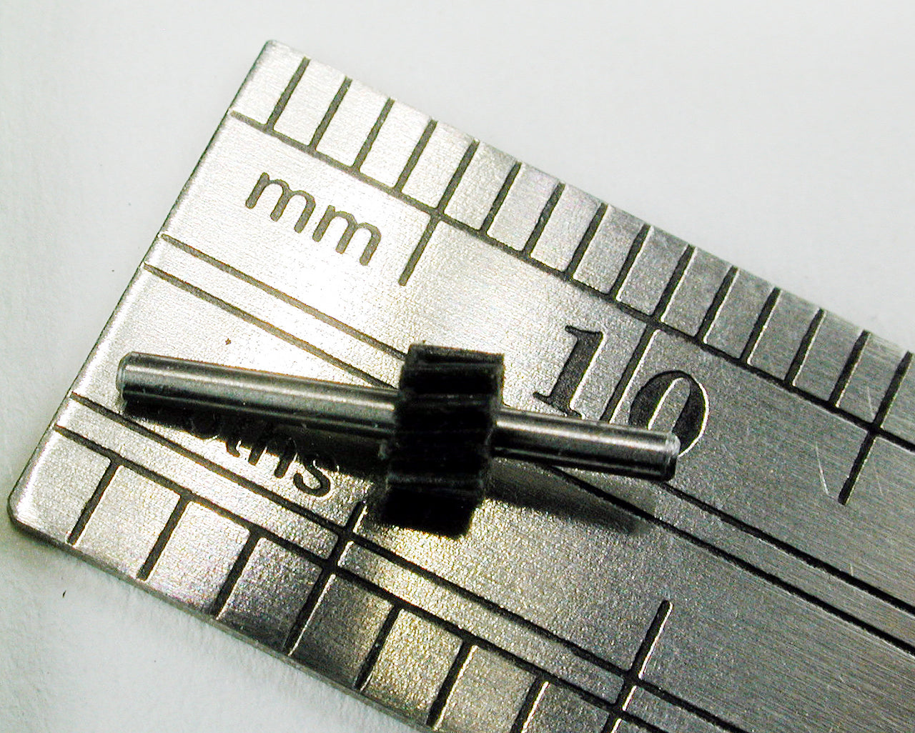 Reverse Worm Gear, 0.25mod x 10 Teeth x 3.0mm OD x 0.082" Face x 1.0mm Bore, Assembled Offset on 1.0mm x 0.443" L Shaft, Delrin